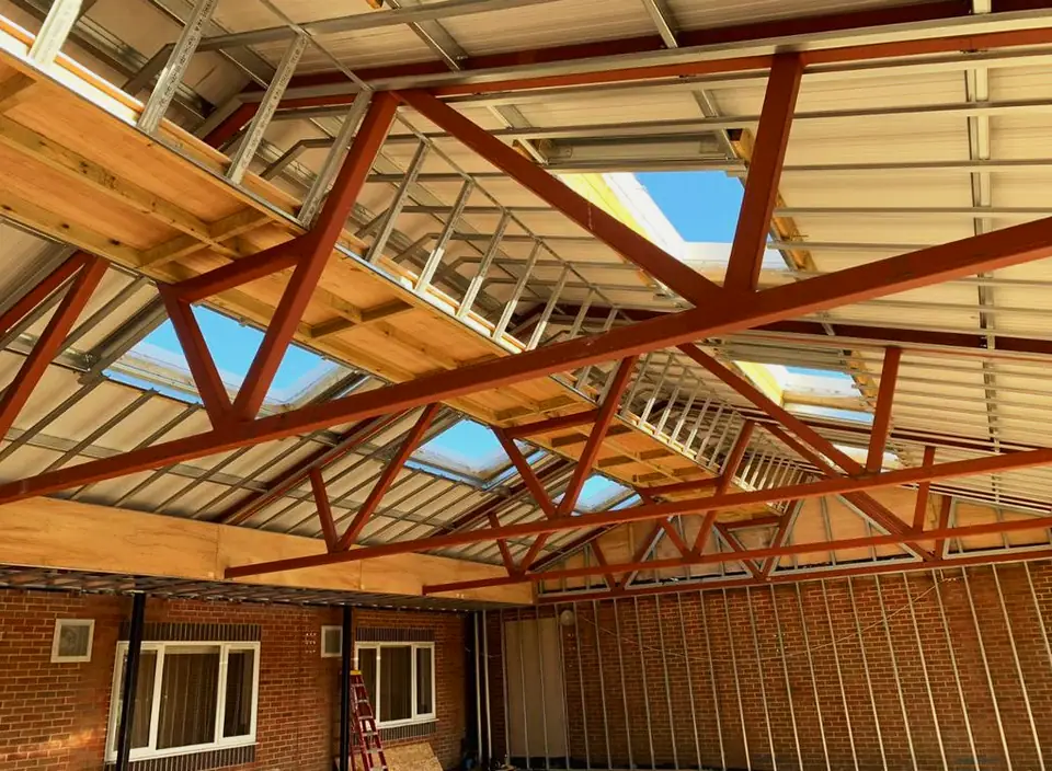 Steel and timber roof trusses with skylights, London project