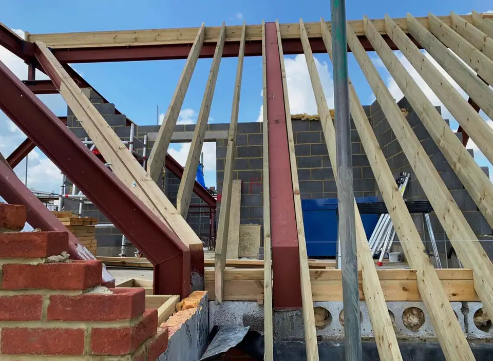 Timber rafters being fixed on a new roof, London project