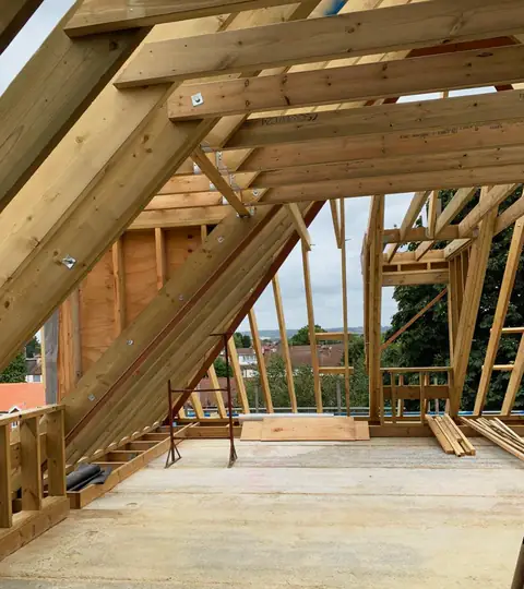 Timber roof framing seen from inside, London project